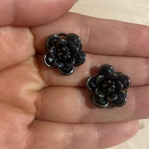 Worn once. All black flower stud earrings.